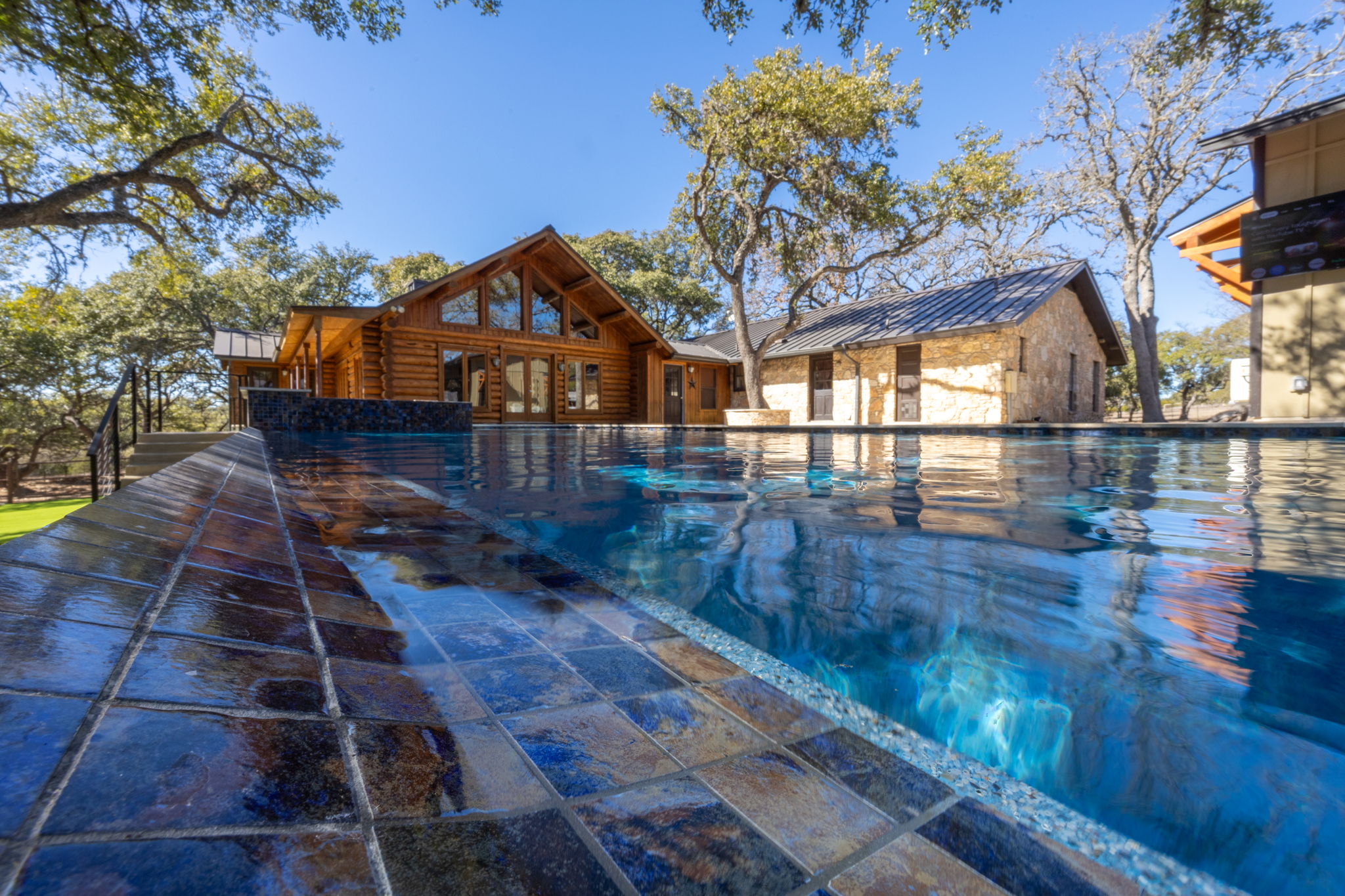 Resort-style pool with outdoor living space